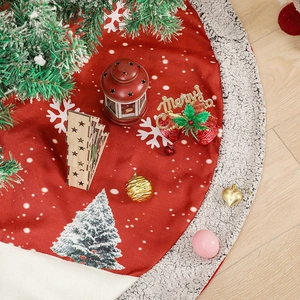 Linen Christmas tree skirt with red snowflake patterns and grey faux fur trim on wood floor