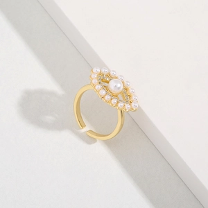 Elegant gold open ring featuring a pearl evil eye design and sparkling cubic zirconia