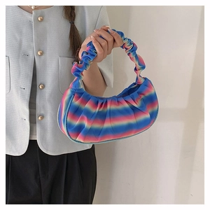 Rainbow gradient pleated hobo bag shown by model for style and size reference