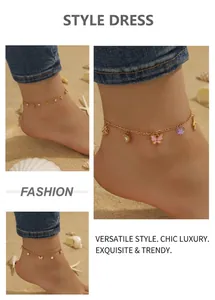 Detail of beach-style anklets featuring colorful butterfly pendants and faux pearls