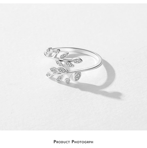 Macro detail of leaf ring with micro-paved zircons in polished 925 sterling silver