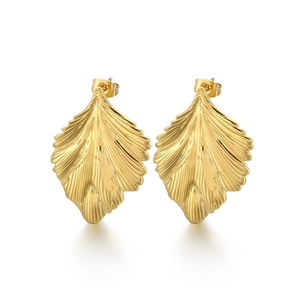 Golden leaf-shaped stud earrings with textured ridges and irregular wavy edges