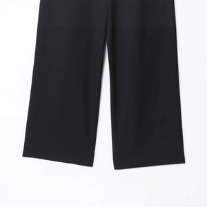 Minimalist black casual pants for women featuring stylish rolled hem and smooth fabric