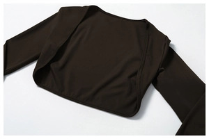 Detail of dark brown long-sleeve yoga cardigan with fine texture and open front design
