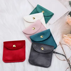 Elegant velvet jewelry pouches with gold snap button in multiple colors for gift packaging