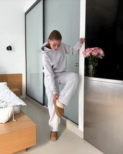 Detail of gray cotton hooded tracksuit set with matching straight-leg pants for women