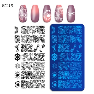 Detail of BC-15 nail art stamping plate with floral, butterfly, and snowflake designs
