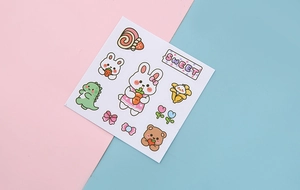 Detailed view of cute cartoon stickers with rabbits, bears and tulips on colorful background