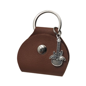 Detailed view of a brown leather guitar pick case with a wing charm and silver ring