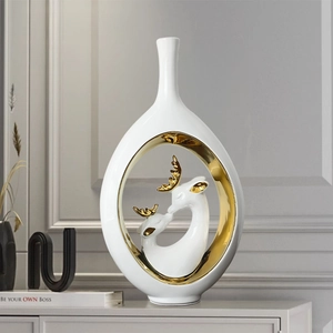 Modern Nordic white ceramic elk vase featuring a golden hollow design and mother-child deer
