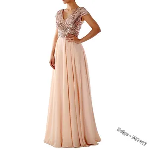 Detailed view of beige V-neck sequined bodice and flowing chiffon evening gown