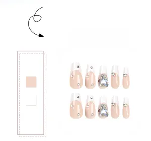 Close-up of nude pink French press-on nails with sparkling rhinestones and crystal gems