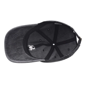 Detail of the 100% cotton washed baseball cap showing the interior spider embroidery