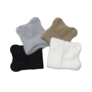 Close-up of fluffy knit cat ear beanies in black, gray, khaki and white colors