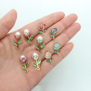 Floral enamel and pearl charms in gold alloy, perfect for DIY jewelry and keychains
