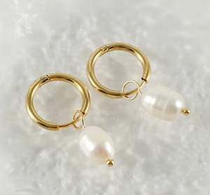 Macro shot of 18K gold-plated stainless steel hoops with natural freshwater pearl charms