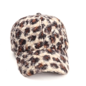 Detailed close-up of leopard print baseball cap featuring textured fuzzy wool fabric