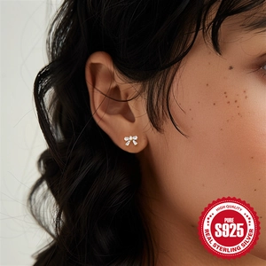 Elegant gold bow earrings in S925 sterling silver with sparkling heart cubic zirconia