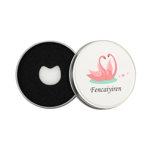Round metal makeup brush cleaner box with pink swan design and dry cleaning sponge