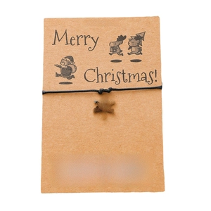 Handmade Christmas snowflake charm bracelet with black braided rope on Kraft paper card