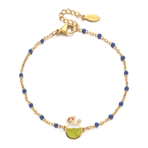 Detail of a gold stainless steel bracelet featuring blue beads and a coconut drink charm
