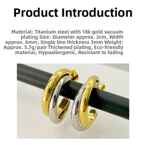 Macro detail of 18k gold and silver two-tone double layer hoop earrings in titanium steel
