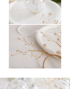 Detailed close-up of golden beaded decorative branch with sparkling crystal accents