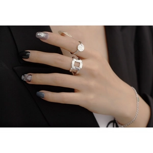 Macro shot of S925 sterling silver rings with irregular foil texture and glossy finish