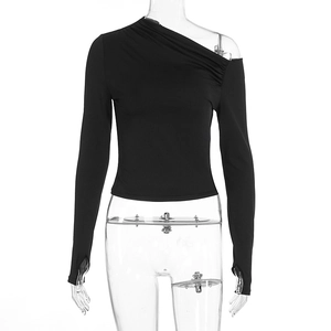 Detail of off-shoulder sleeve with thumbhole design and pleated fabric on black top