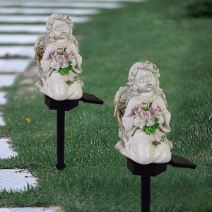 Solar outdoor garden light featuring a kneeling angel statue with pink roses and resin finish