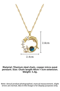 Macro detail of gold dolphin and star pendant with blue gemstone and dimensions