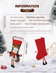 Detailed view of a polyester Christmas stocking with penguin motif and 46cm length size