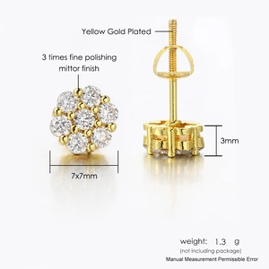 Detail view of gold flower stud earrings with micro-set zircons and screw back