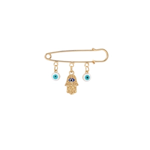 Detail of gold safety pin brooch with Hamsa hand and blue Evil Eye charms