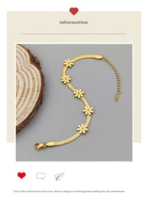 Detail of gold daisy flat blade chain bracelet with lobster clasp and extension link