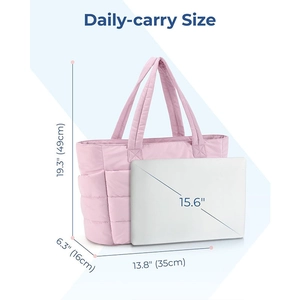 Pink quilted tote bag shown with 15.6 inch laptop for daily size comparison