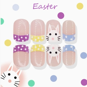 Easter themed press-on nails featuring cute cartoon rabbits and polka dots in macaron colors