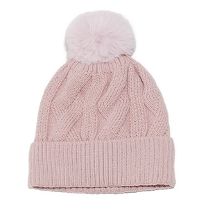 Detail of light pink knitted beanie featuring chunky cable pattern and fluffy faux fur pompom