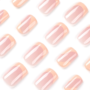 Pink French press-on nails with orange wave tips in a short square shape on white background