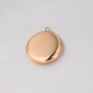 Macro shot of mirror-polished 316L stainless steel round locket pendant in rose gold finish