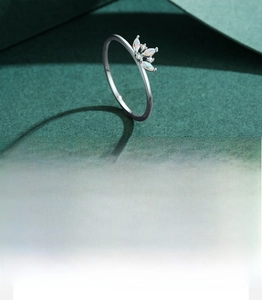Macro detail of crown ring with 5A grade zircon stones and handmade silver setting