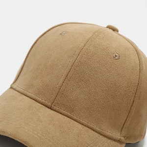 Detailed view of camel faux suede baseball cap showing fine stitching and velvet texture