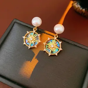 French vintage gold plated mother of pearl stud earrings with sunburst and crystal detail