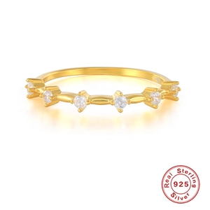 Macro detail of S925 sterling silver ring with gold plating and six sparkling zircons