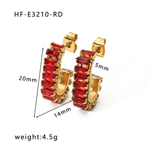 Detail view of 18K gold earrings with red zircon showing 20mm height and 4.5g weight