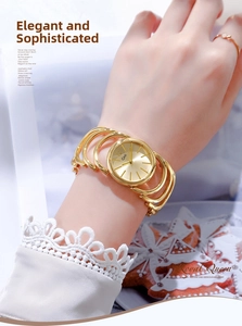 Close-up of Gedi gold bracelet watch with a multi-layered hollow band and sunburst dial