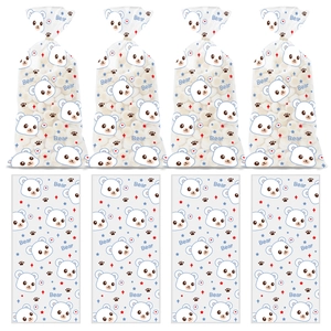 Detail view of clear plastic gift bags with cute blue bear patterns for snacks