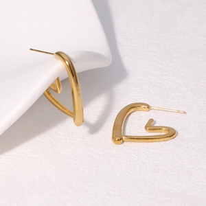 Minimalist gold heart-shaped hollow stud earrings made of polished stainless steel