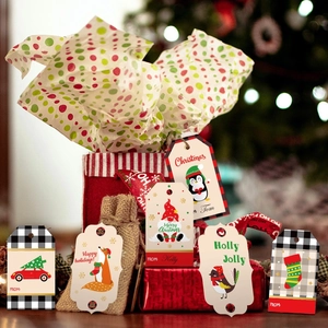 Close-up of festive Christmas gift tags featuring penguins, foxes and Santa designs