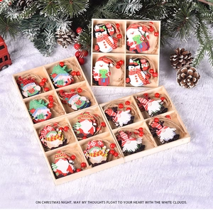 Detail shot of Christmas wooden pendants in a storage box with festive decor